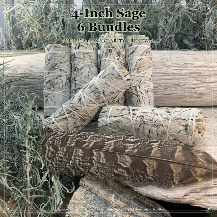 Six 4-inch sage bundles stacked together on weathered wood