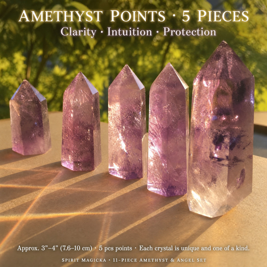 Five translucent lavender amethyst points standing in a row in warm sunlight