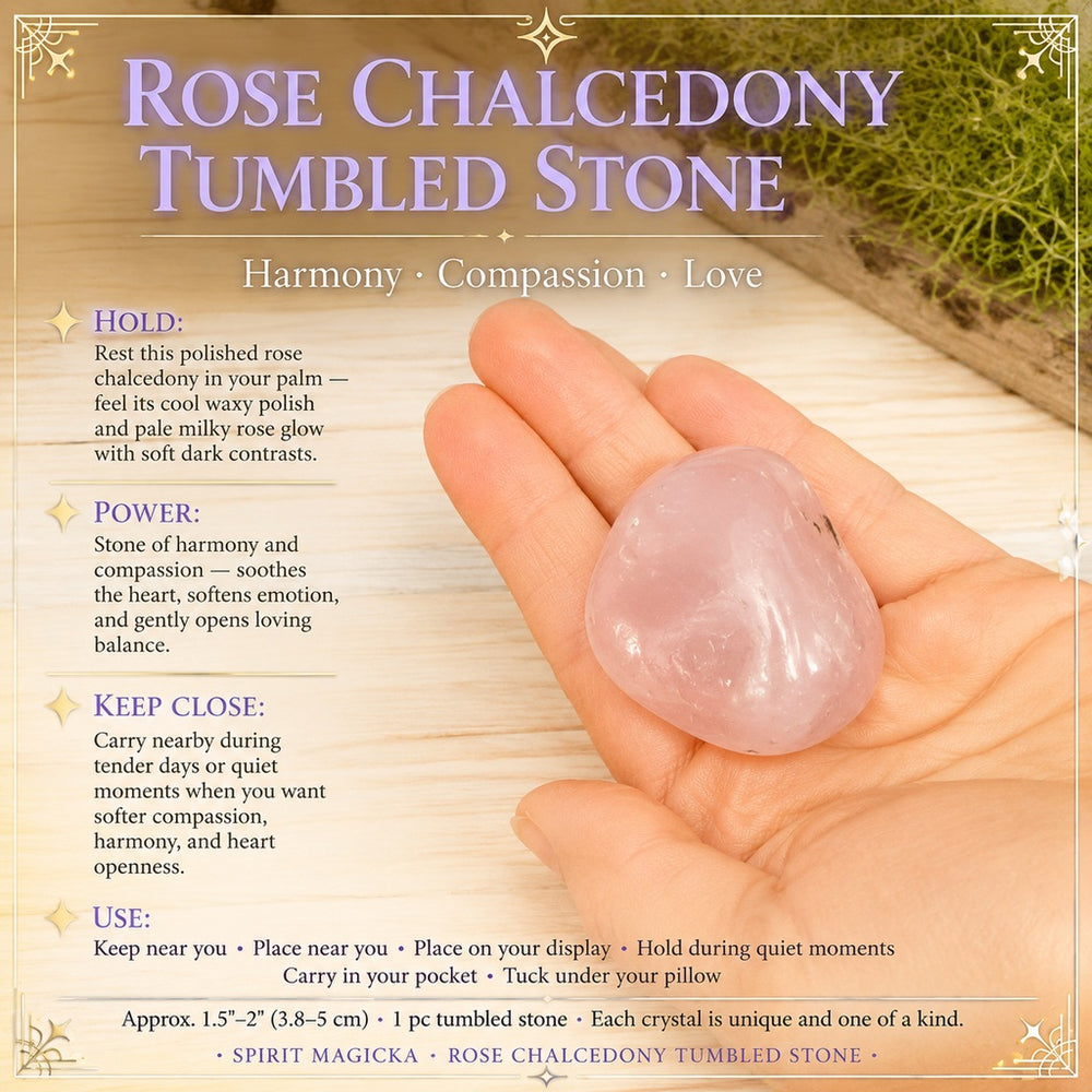 A polished pale pink rose chalcedony tumbled stone resting in an open palm