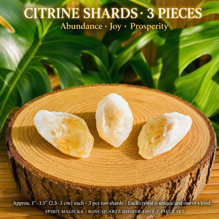 Three raw citrine shards with milky white bases and golden tips on a wood slice