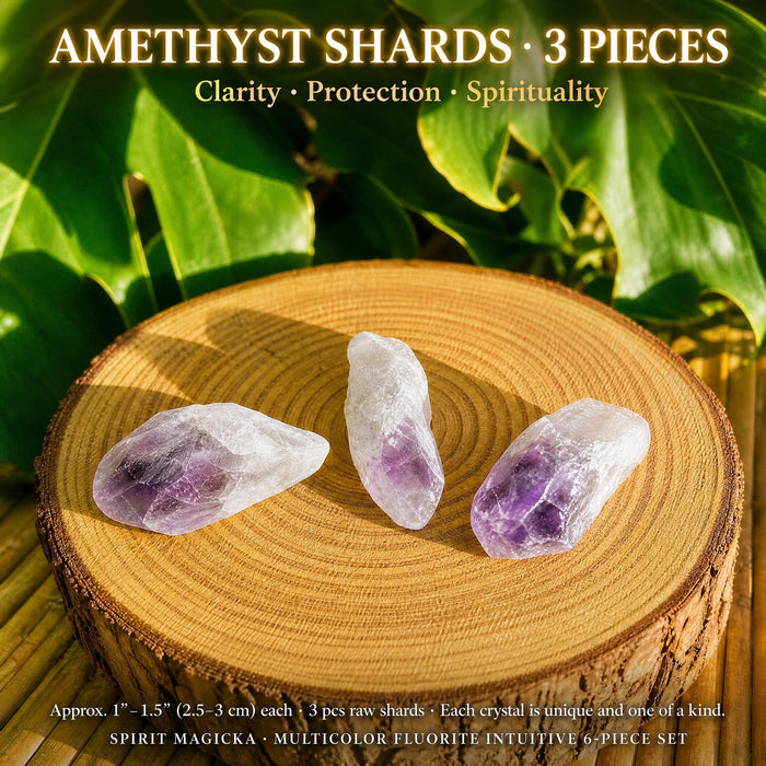 Three raw purple and white amethyst shards on a wood slice
