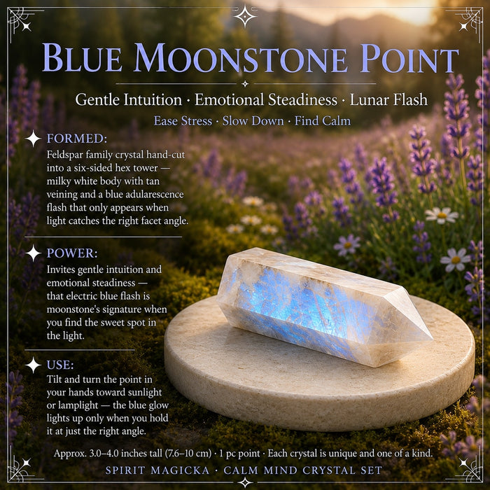 A blue moonstone point lying on a stone disc, glowing with a blue flash