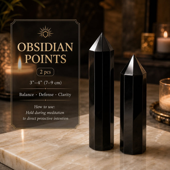 Two medium hexagonal obsidian points