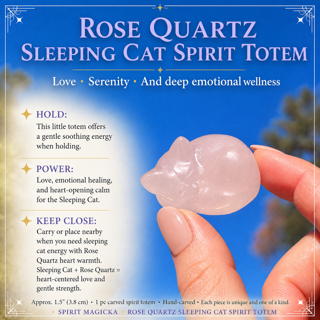The rose quartz sleeping cat held between thumb and finger against a blue sky