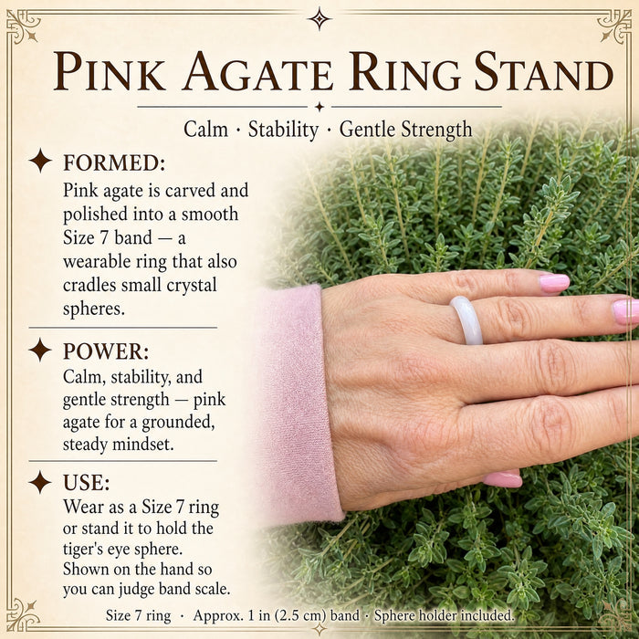 Pale pink agate ring worn on a hand