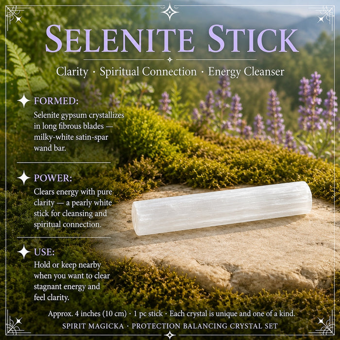 Milky white fibrous selenite stick lying on a flat stone