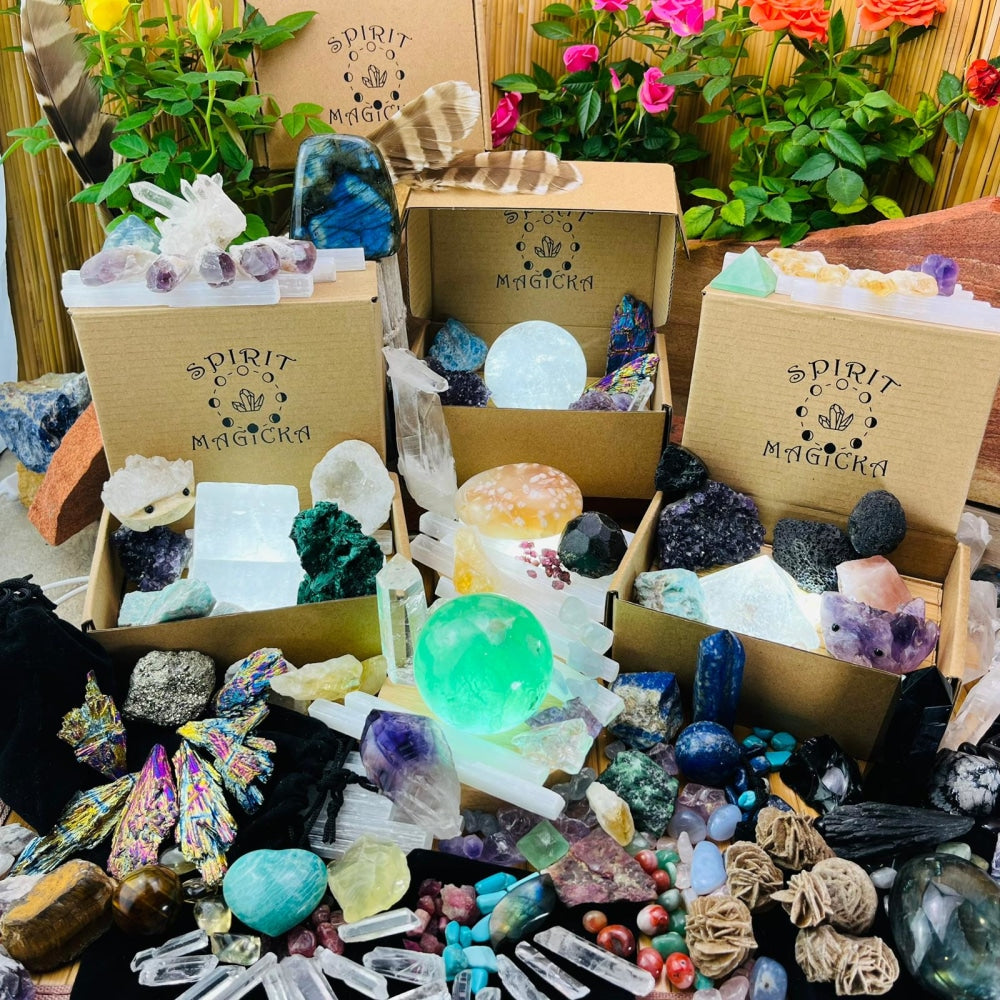 Spirit Magicka boxes overflowing with crystals: clusters, points, spheres, tumbled stones and raw pieces in many colours