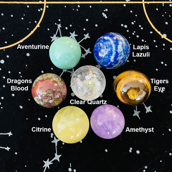 Seven labelled mini spheres: aventurine, lapis lazuli, dragons blood, clear quartz, tigers eye, citrine and amethyst