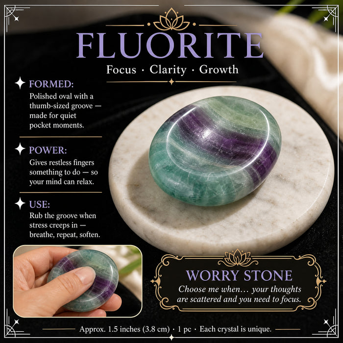 Fluorite worry stone: bands of green and violet, with a thumb groove