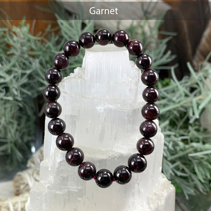 Garnet bead bracelet on a selenite tower