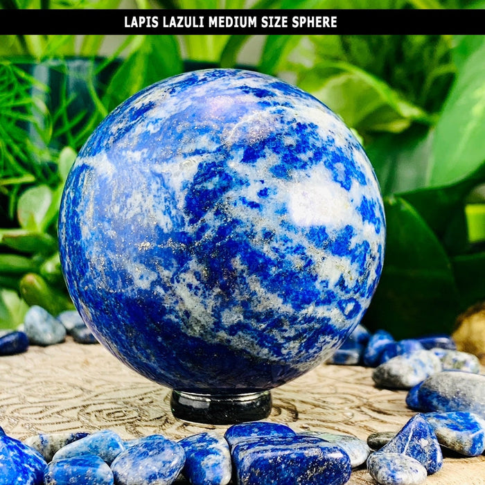 A polished medium lapis lazuli sphere swirled with blue and white, resting on a black stand