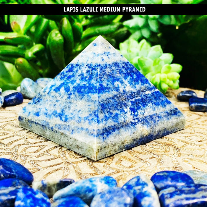 A medium lapis lazuli pyramid with blue bands across pale stone