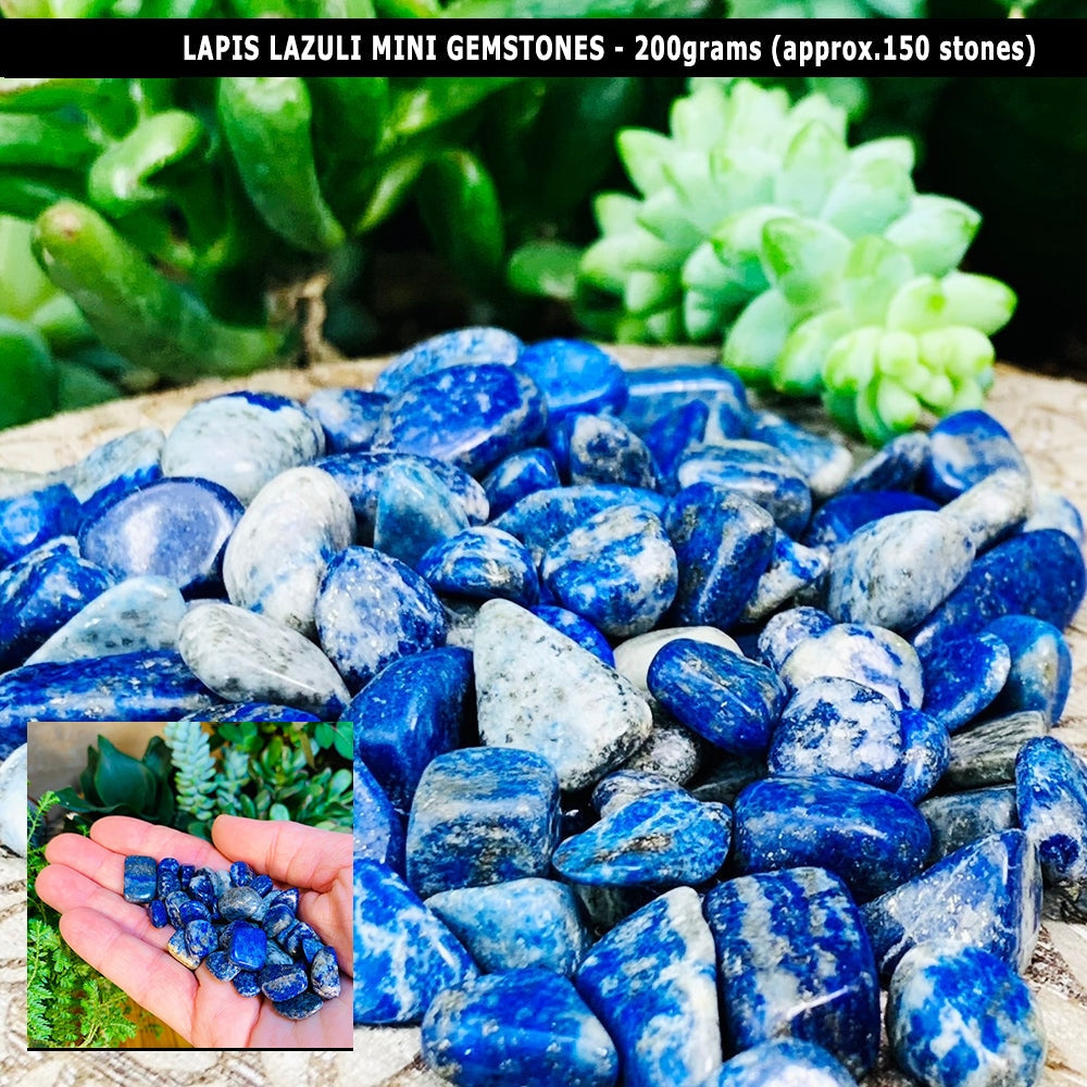 A heap of small tumbled lapis lazuli gemstones, with an inset of a handful held in an open palm