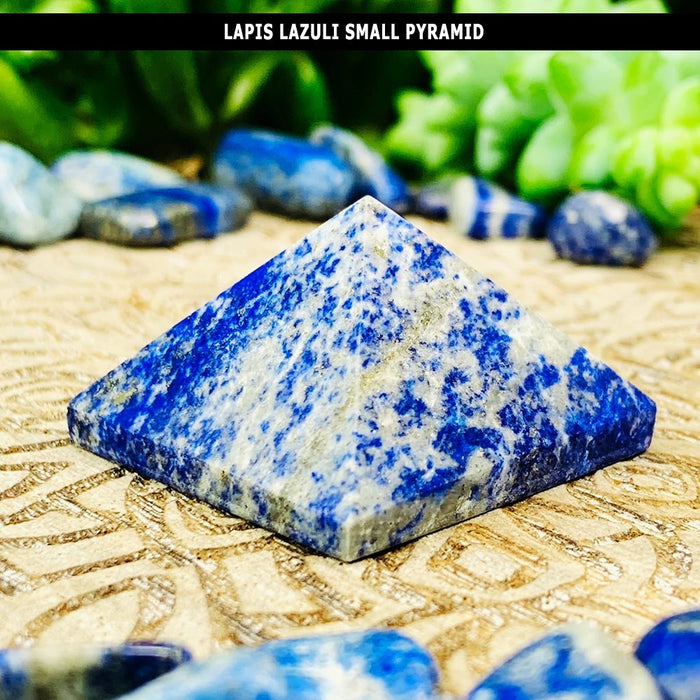 A small lapis lazuli pyramid speckled with bright blue